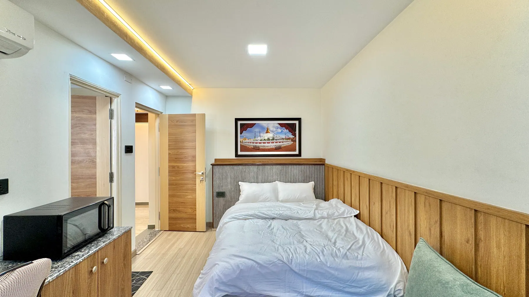 Double bed and wood-panel interior in the deluxe room