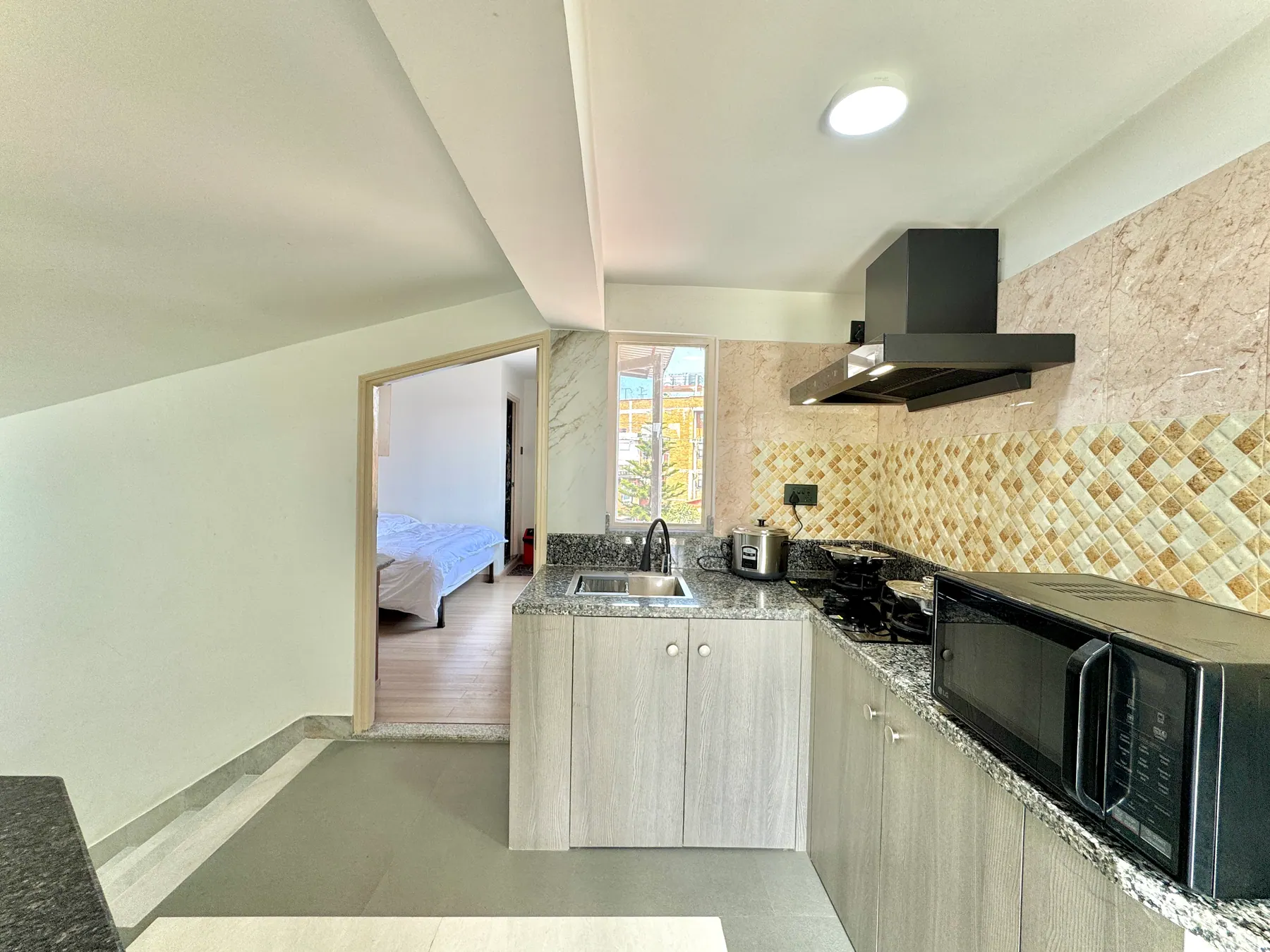 Second bedroom in the high-floor three-bedroom apartment